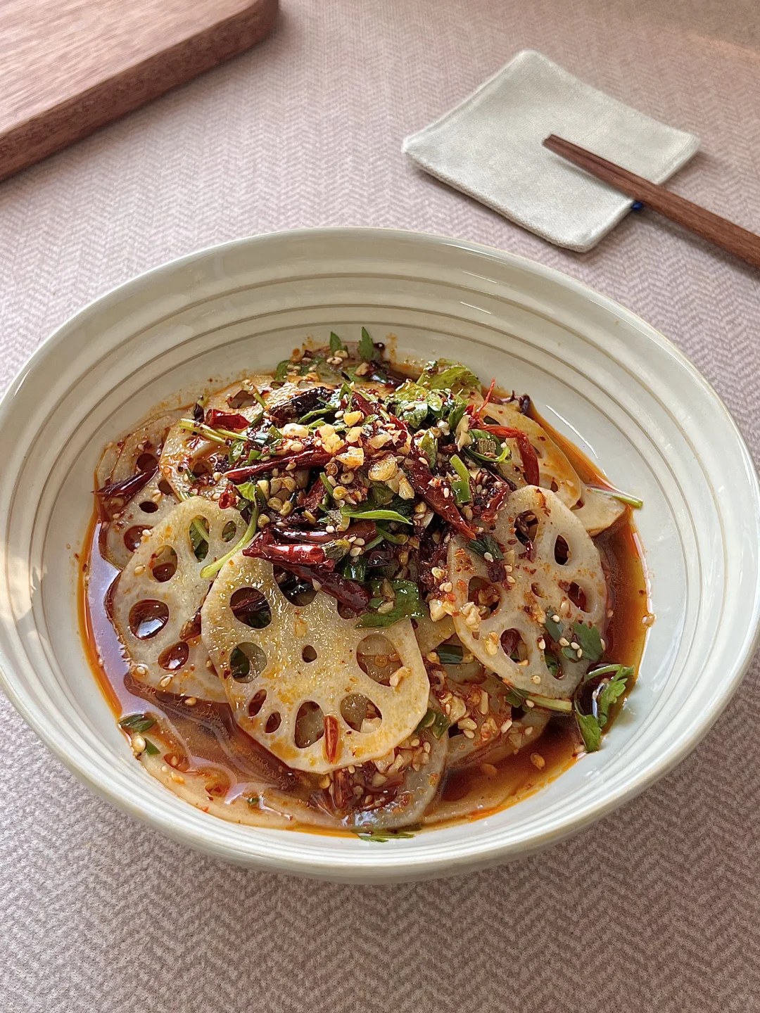 Thin lotus root slices with red chiles, sesame and cilantro.