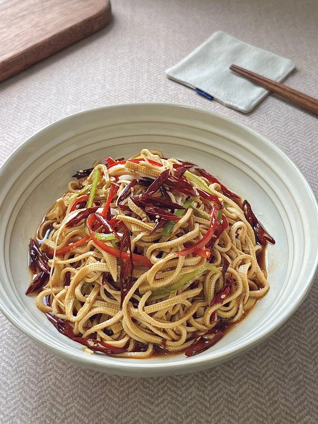 Fine tofu strips with shredded peppers and sesame.