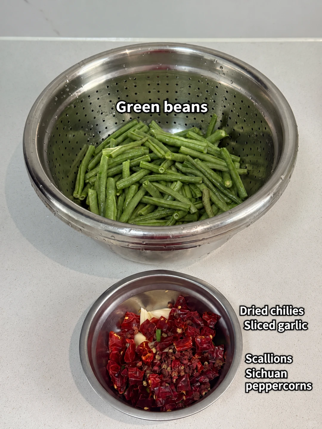 English-captioned photographs showing ingredient preparation and cooking for Dry-Fried Green Beans with Chiles.