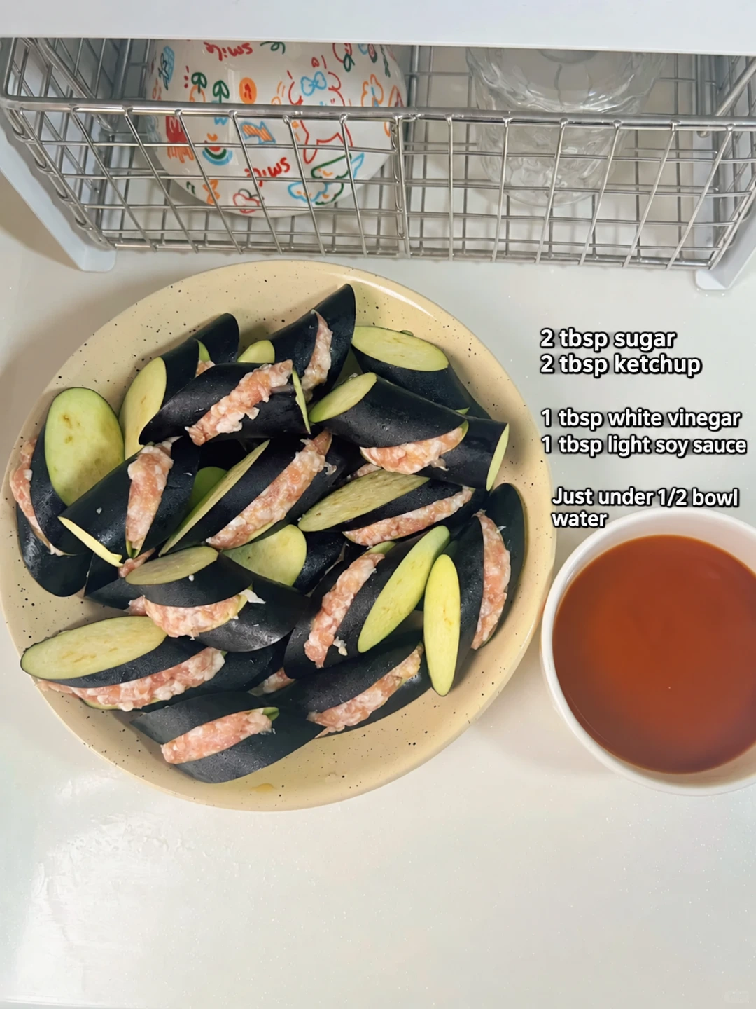 English-captioned photographs showing ingredient preparation and cooking for Sweet and Sour Pork-Stuffed Eggplant.