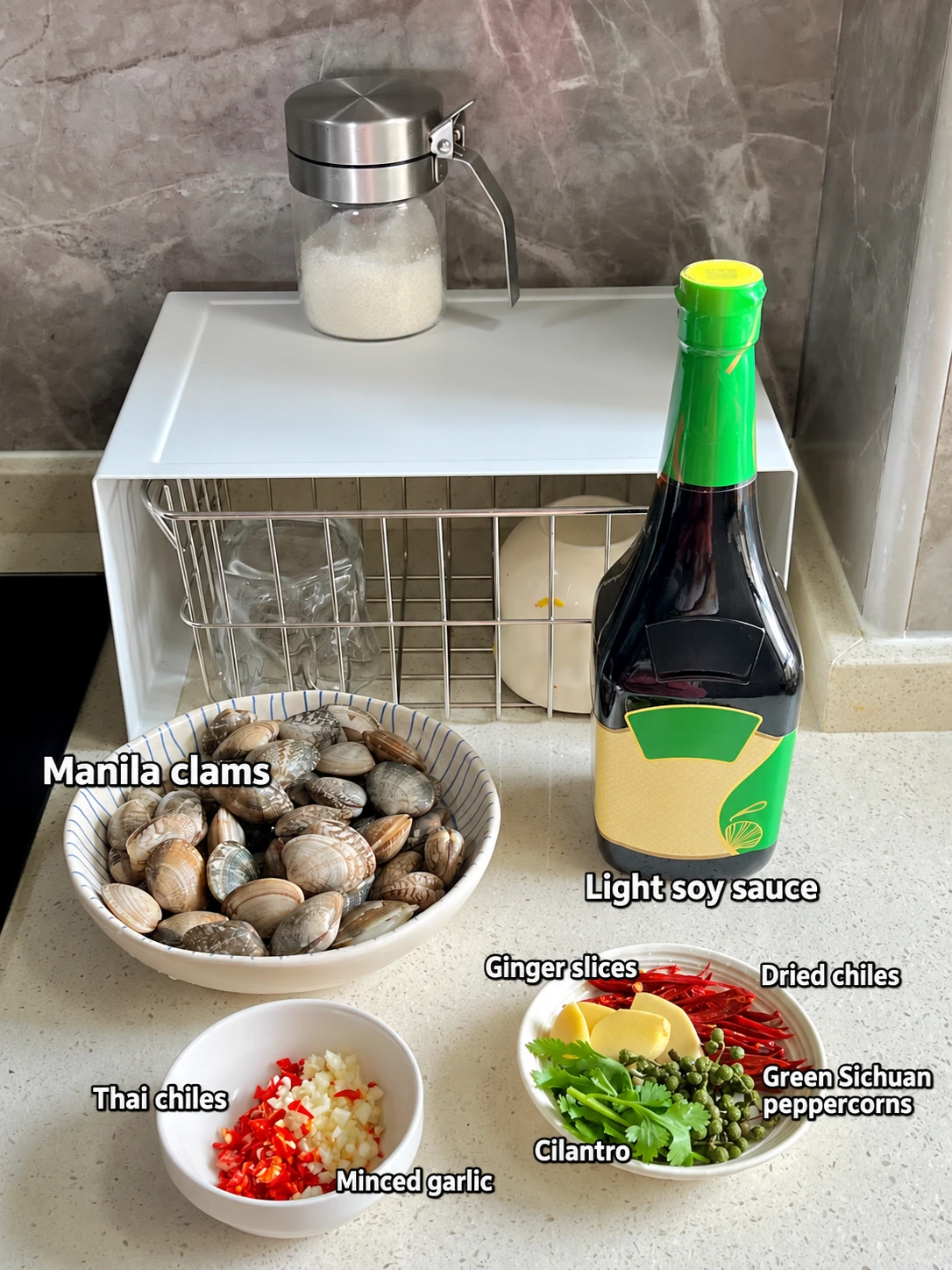 English-captioned photographs showing ingredient preparation and cooking for Clams with Hot-Oil Chile Dressing.