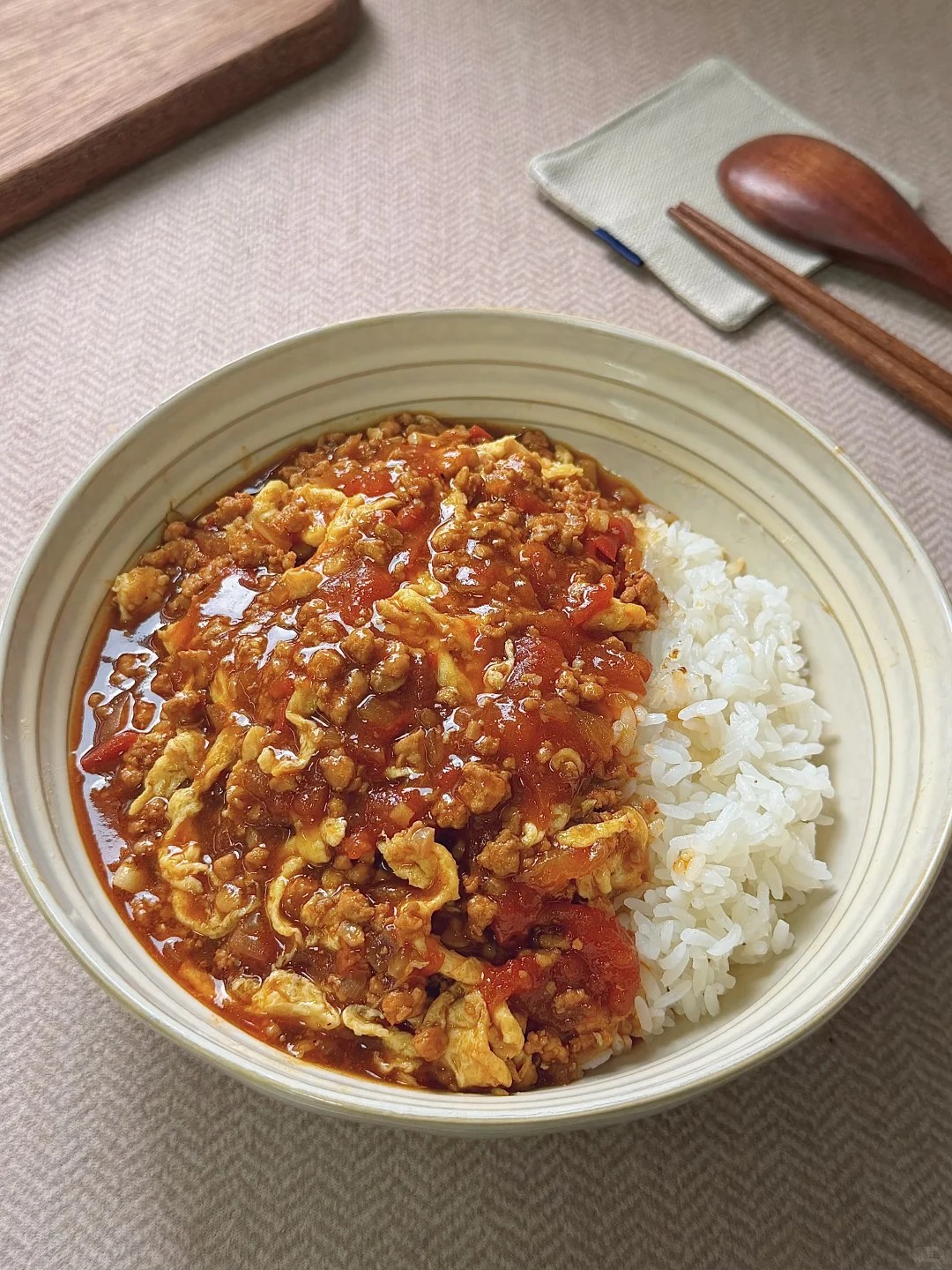 Tomato and ground pork sauce with egg over rice.
